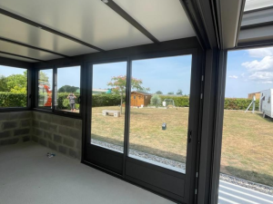 Extension de maison en aluminium avec véranda toit plat Calvados