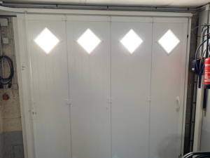 Pose d’une porte de garage sectionnelle by Fame